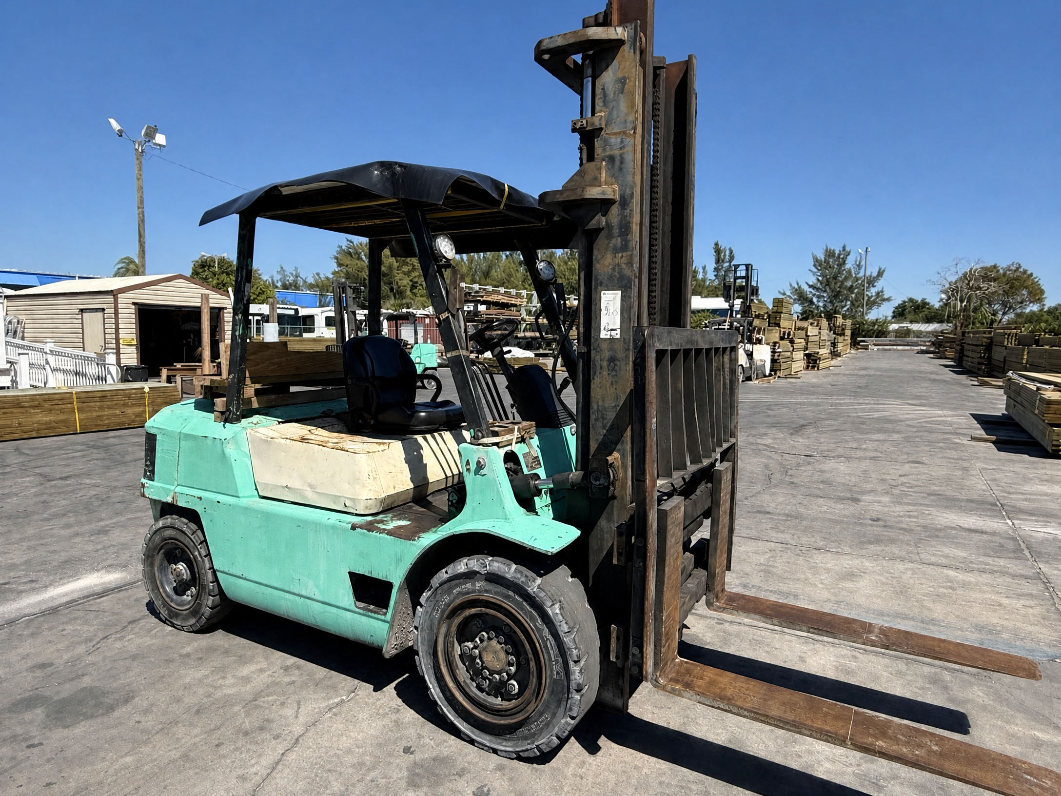 Used forklift in a working lumber yard